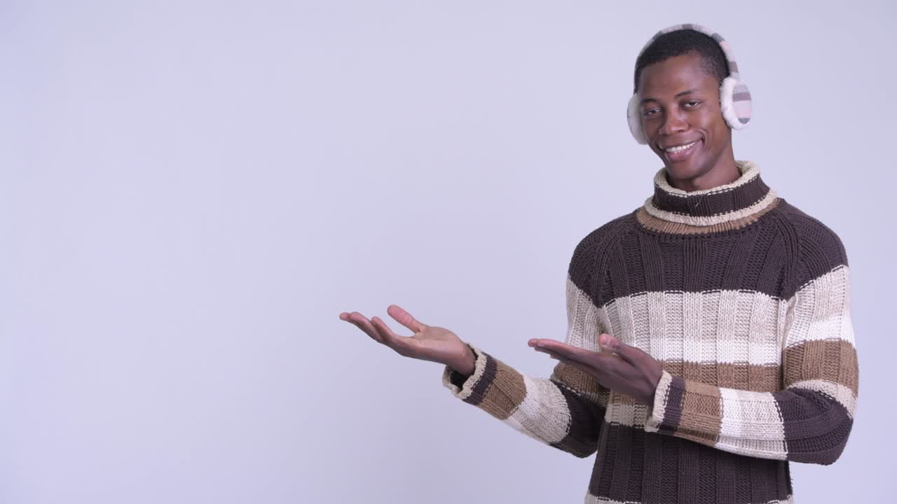 Young handsome African man ready for winter