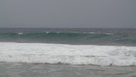 waves crashing off of stormy coastline