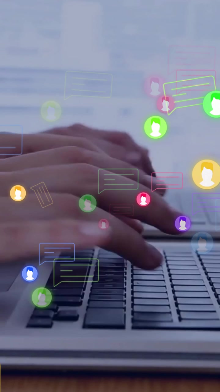 Animation of social media icons with speech bubbles over diverse colleagues using laptops