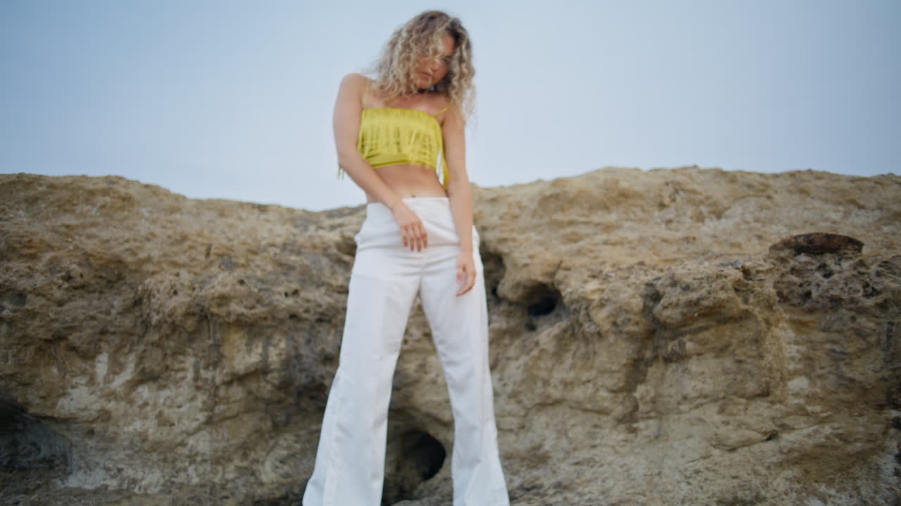 Sensual girl dancing stones summer day. Dreamy woman dancer practicing dance