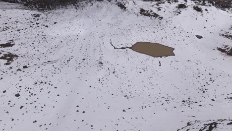 Drone-journey-over-Carihuairazo-Volcano,-one-of-most-famous-expeditions-in-Ecuador