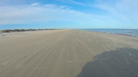 pov while driving an off road vehicle on quiet beach at north padre island national seashore near corpus christi texas usa