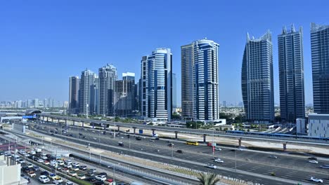 dubai cityscape: stunning aerial view of modern skyscrapers and highway traffic