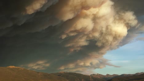 tilt to lake granby from billowing smoke clouds of troublesome fire