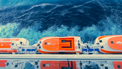 timelapse looking down at lifeboats on a cruise ship