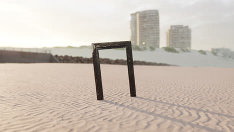 empty wooden picture frame on the beach sand