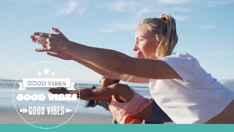 animation of good vibes text over diverse women practicing yoga at beach