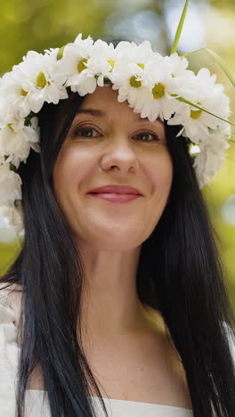 happy middle aged woman smiling looking away dreaming resting good news feel satisfied in park