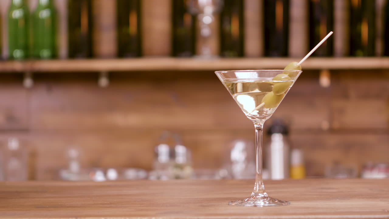Martini with Olives on a Bar