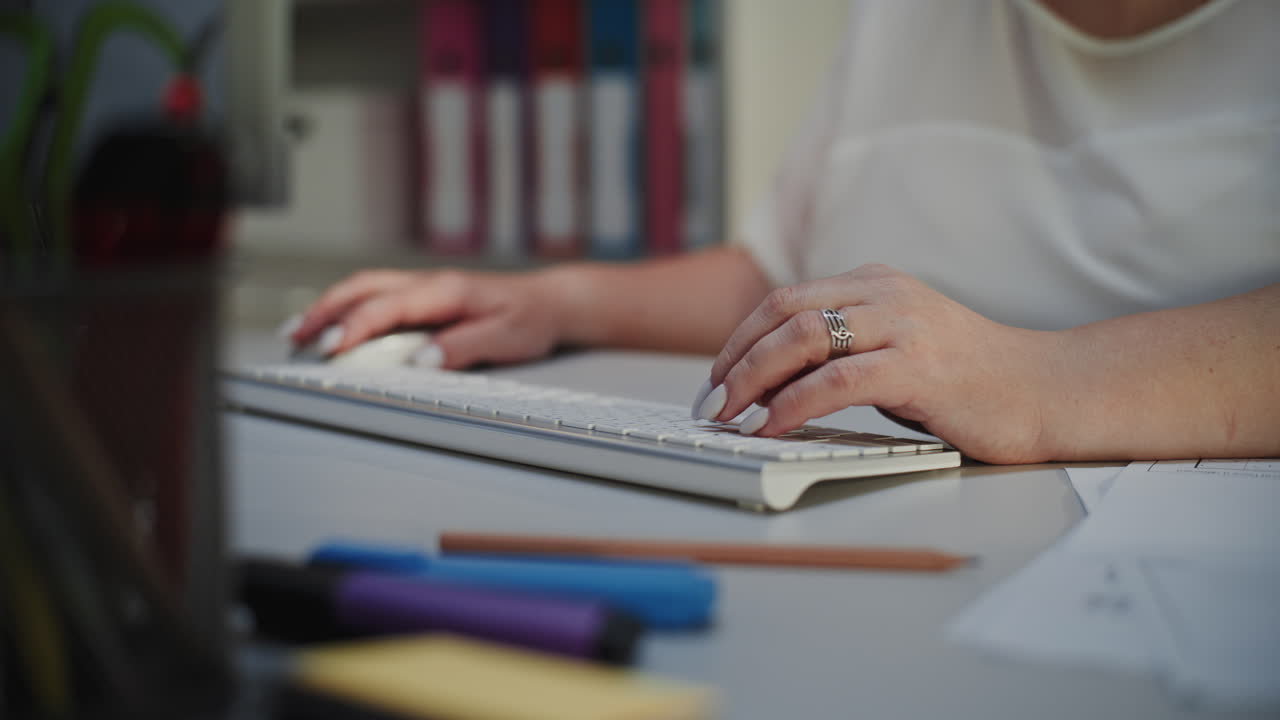 Elementary School Teacher Working on Computer at Night Checking Homework