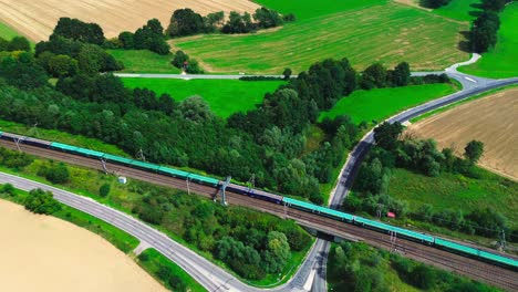 aerial drone cargo train along highway 4k