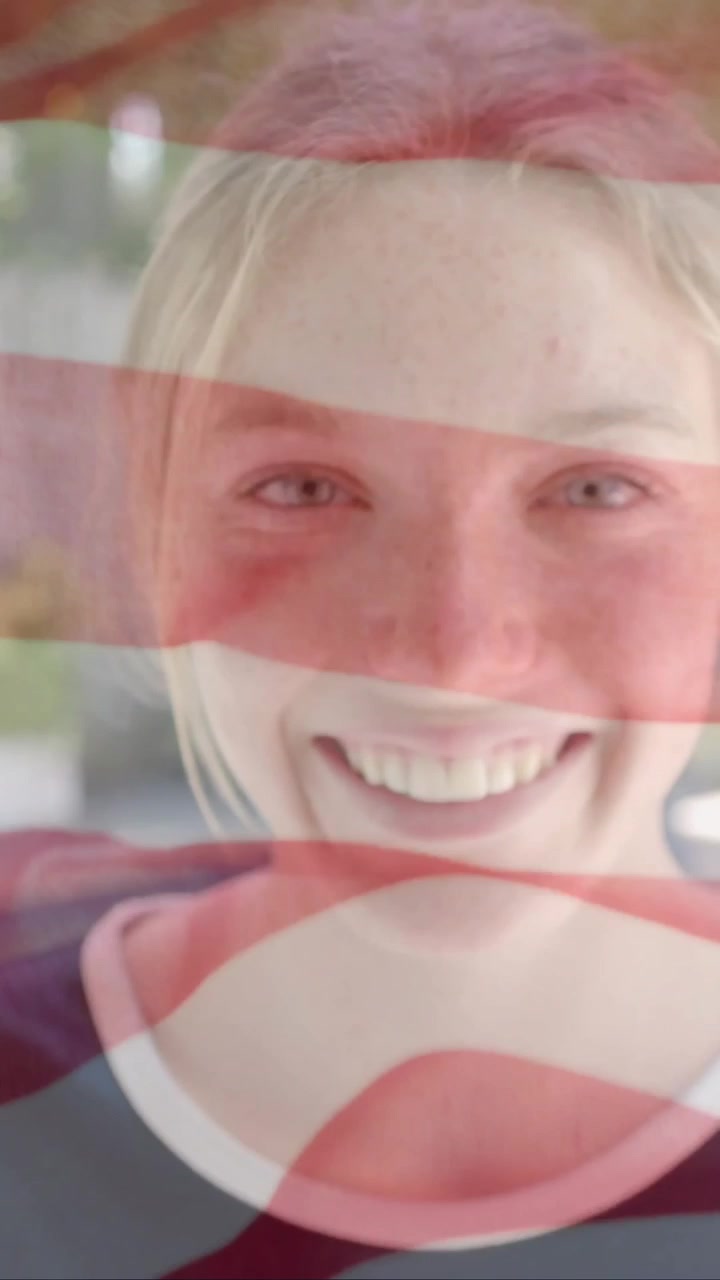 Animation of smiling caucasian woman over flag of usa
