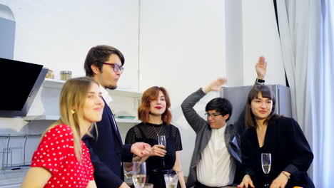 friends celebrating in a kitchen