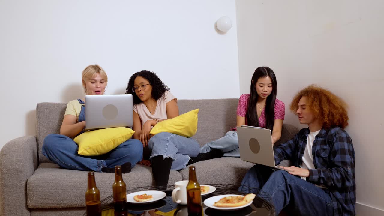 Friends Relaxing with Tech, Food, and Drinks