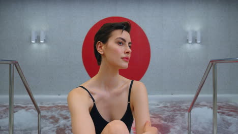 woman relaxing in a modern spa hot tub