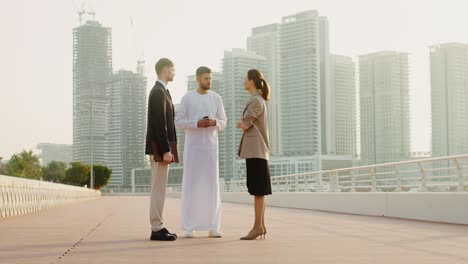 business meeting on a city bridge