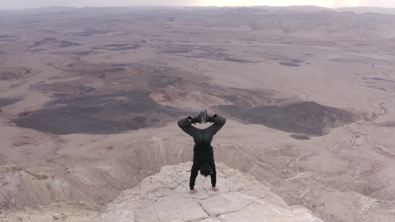 Handstand on a Desert Clifftop
