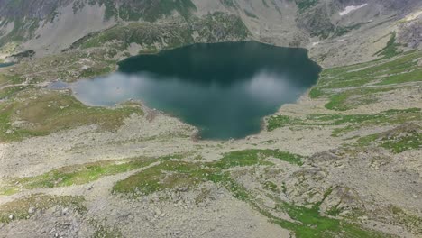 fpv drone soaring above tranquil mountain lake in the slovakian high tatras