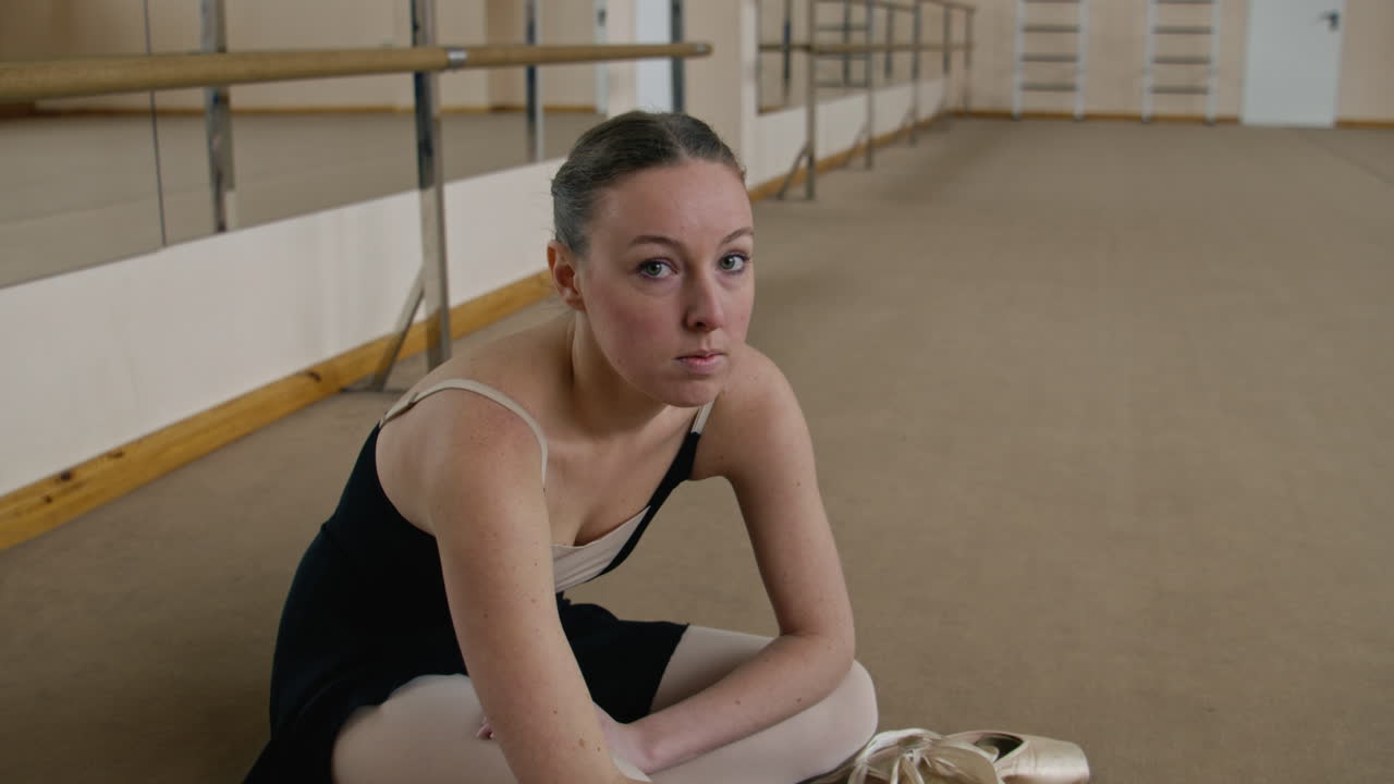 Ballet Dancer Resting in Studio