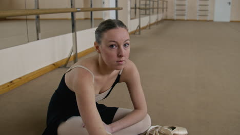 ballet dancer resting in studio