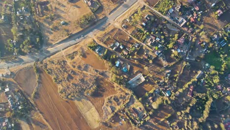 sunrise- kenya landscape with a village, kilimanjaro and amboseli national park - tracking, drone aerial view