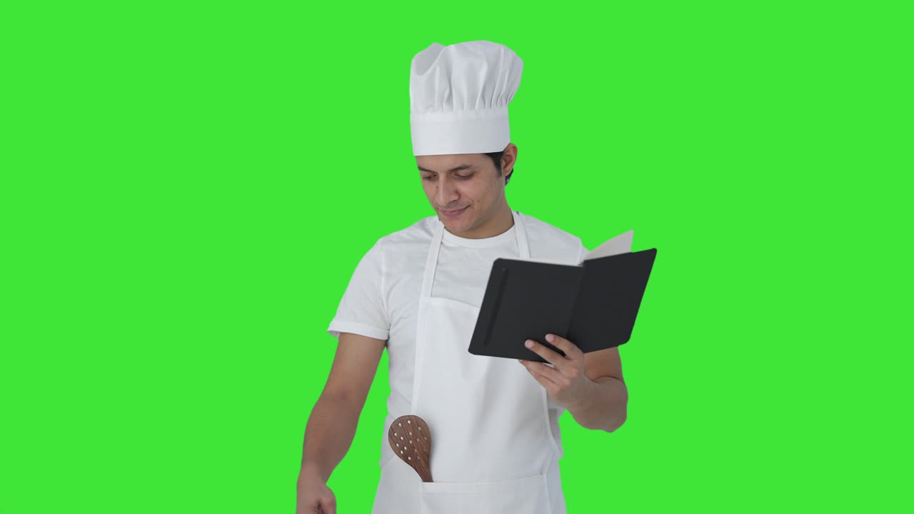 chef profesional indio haciendo comida con emoción pantalla verde