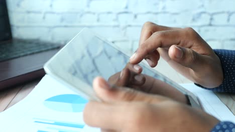 person using tablet in office