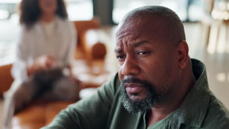 a man experiencing sadness during a counseling session