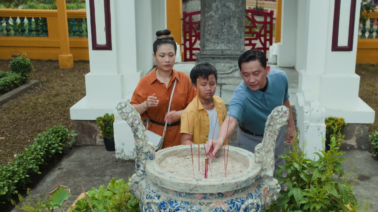 Spouses and Son Visiting Ancient Altar