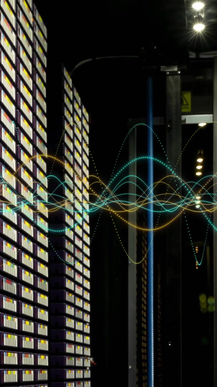 Animation of multicolored graphs over data server racks in big server room