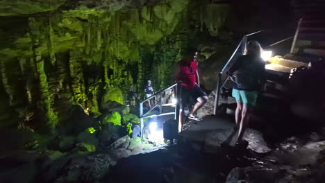 Visitors gaze in wonder at stalagmites and stalactites at the birthplace of Zeus