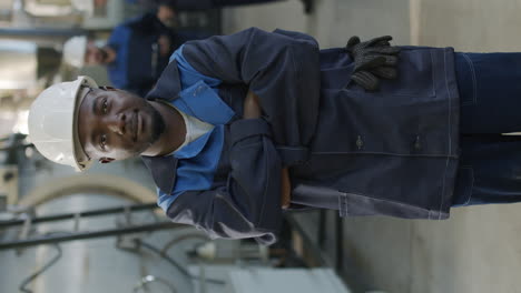 vertical portrait of black male factory worker