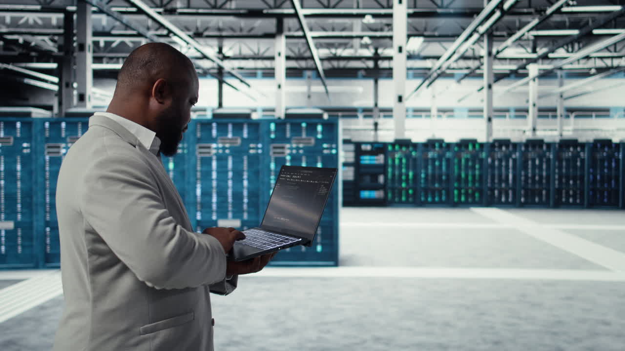 Vertical video Server room engineer deploying new builds to improve uptime using software