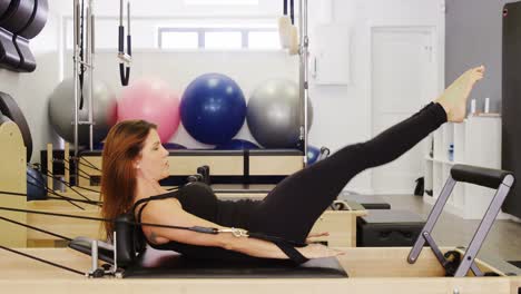 Beautiful-woman-exercising-in-fitness-studio