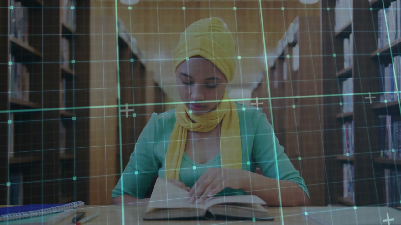 woman student sliding hands onto book and flipping pages under green grid overlay for library study