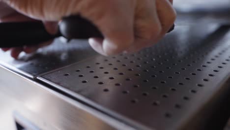 Close-up-of-hand-taking-knife-to-cut-kebab