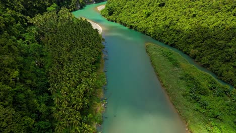 drone flying over daywan river, surigao del norte, philippines