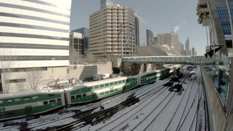 trains departing union station in downtown toronto in winter.