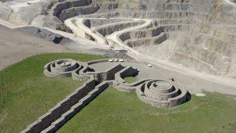 an aerial view of the coldstones cut public artwork near pateley bridge with an asphalt quarry in the background