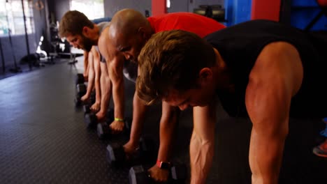 Group-of-people-exercising-with-dumbbell