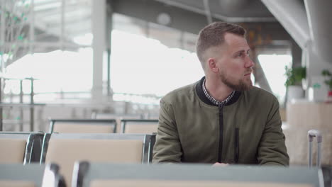 man waiting at airport