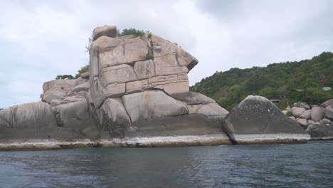 Traveling-on-the-boat-with-the-rocks-looks-like-human-face,-Koh-Tao-island,Thailand