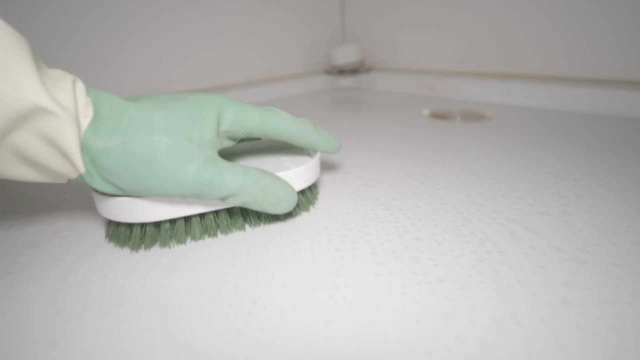 Cleaning a shower floor