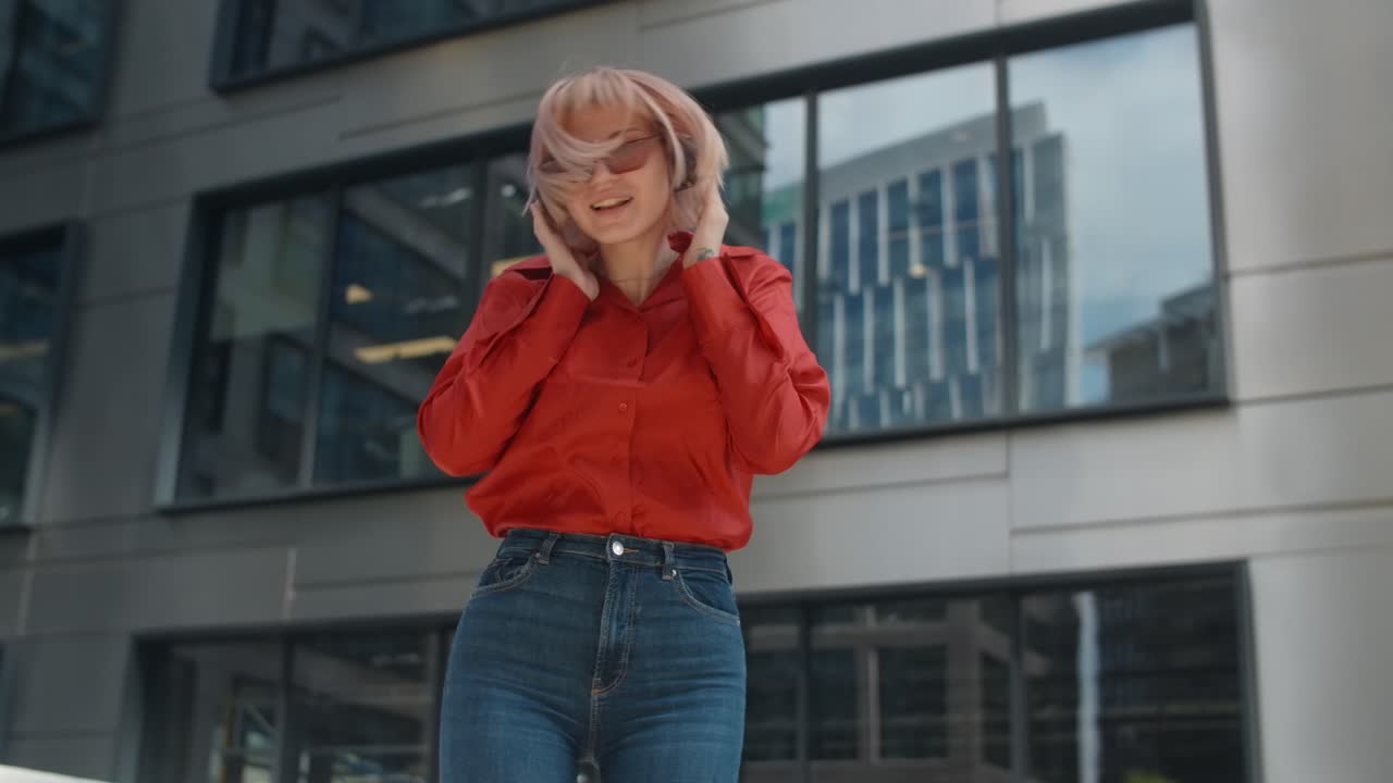 Woman listening to music in a city