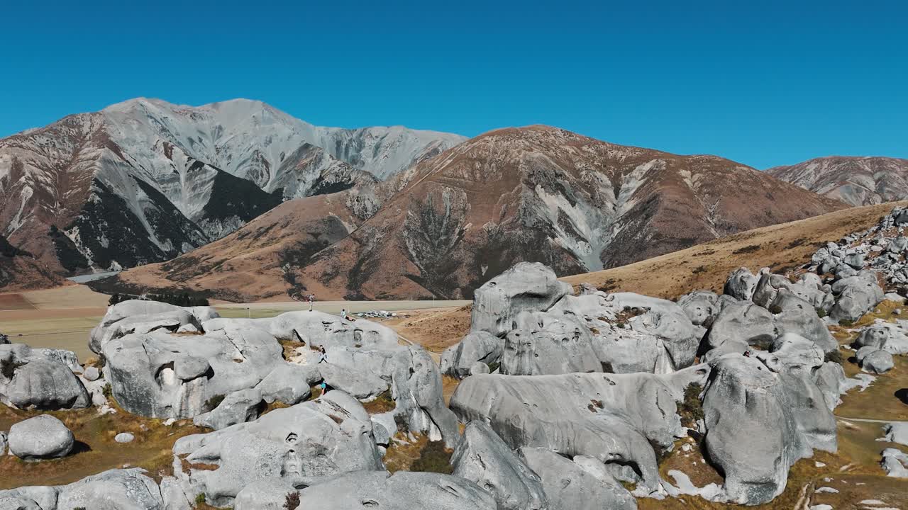 People Standing on Maori Sacred Rocks in Arthur’s Pass. Aerial view