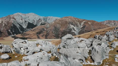 people standing on maori sacred rocks in arthur’s pass. aerial view