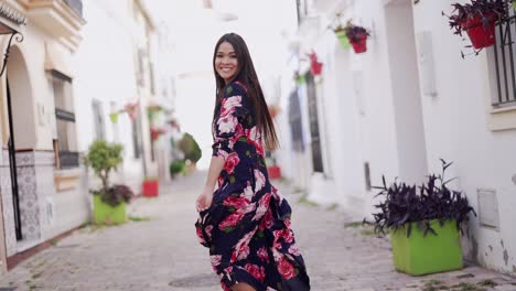 woman in a floral dress in a charming european city