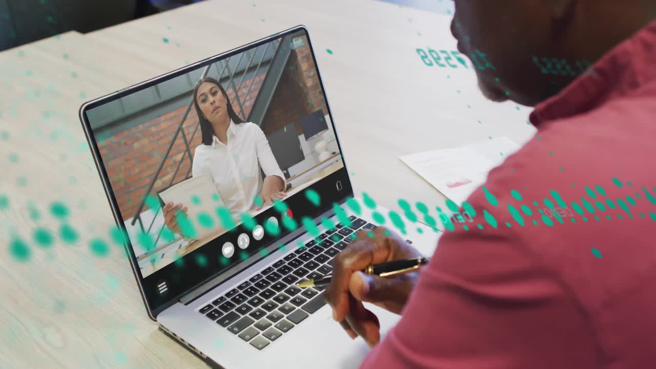 Animation of financial data processing over african american man on laptop video call