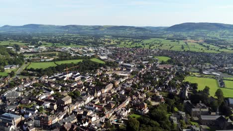 Denbighshire-residential-suburban-North-Wales-countryside-housing-estate-aerial-view-pan-right-urban-scene