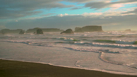 dramatic seascape with sea stacks in bandon, oregon coast, during a beautiful and dramatic sunset